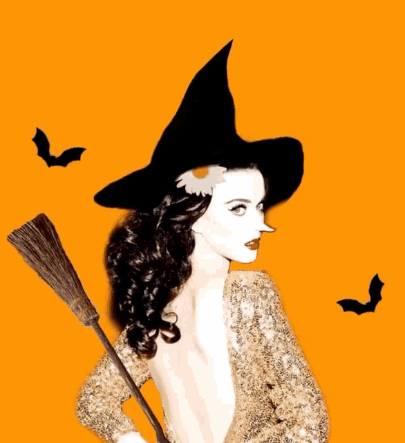 a woman in a witch costume is holding a broom in front of bats