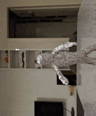 a statue of a person made of aluminum foil