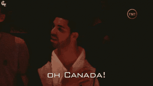 a man says " oh canada " in a dark room