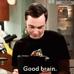 a man in a black shirt is holding a tablet and says good brain