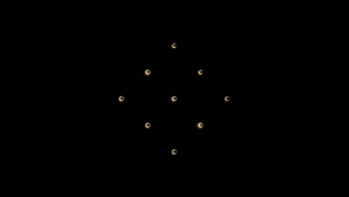 a group of lights are moving in a circle in the dark .