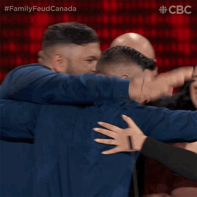 Celebrate Family Feud Canada GIF - Celebrate Family Feud Canada Group Hug GIFs