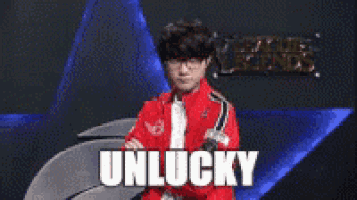 a man in a red jacket is standing in front of a league of legends logo
