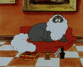 a cartoon cat sits on a red couch next to a bottle of wine and a box