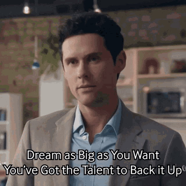 a man in a suit says " dream as big as you want "