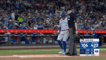 a blue jays baseball player walks off the field during a game