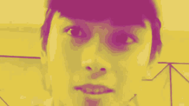 a person wearing a purple hat that says ichi on it