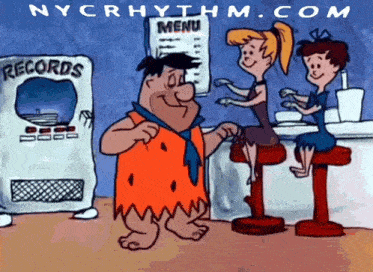 a cartoon of flintstone standing in front of a menu