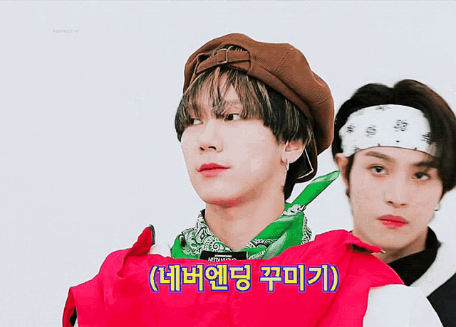 a man wearing a bandana stands next to another man in a red jacket