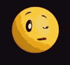 a yellow smiley face with big eyes and a smile on it 's face on a black background .