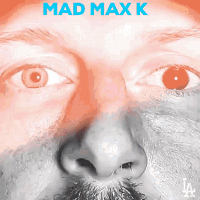 a close up of a man 's face with the words mad max k written above it