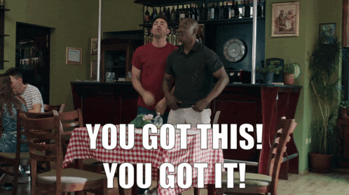 two men dancing in a restaurant with the words " you got this you got it "