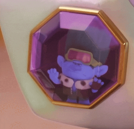 a cartoon character is sitting inside of a purple stone .