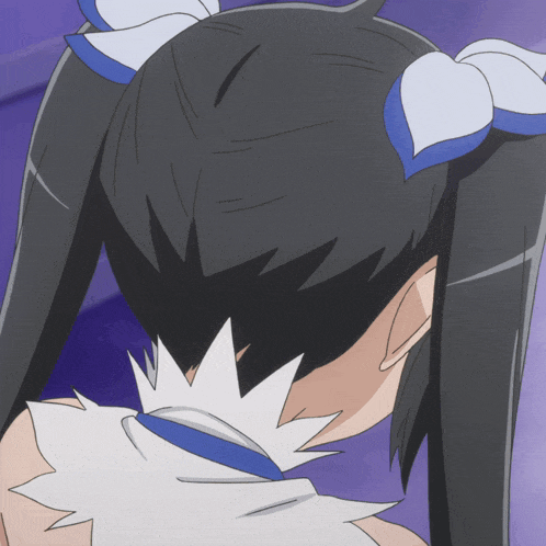 a close up of a person 's hair with a blue and white ribbon
