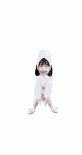a girl wearing a bathrobe and a towel on her head