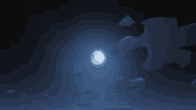 a full moon shines brightly in the dark sky