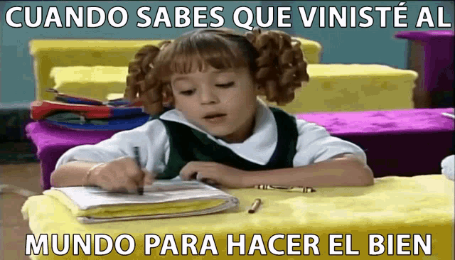 a little girl is sitting at a desk with a notebook and a pen in front of her and the words mundo para hacer el bien are above her