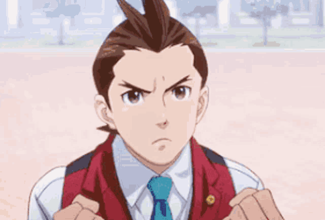 a man in a suit and tie is making a serious face