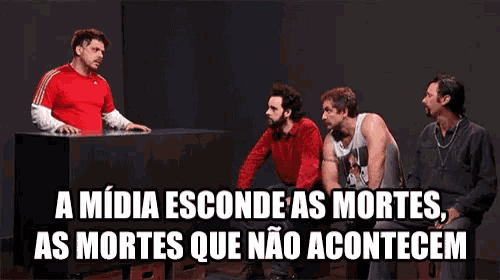 a group of men are sitting around a table with the words " a midia esconde as mortes as mortes que não acontecem "
