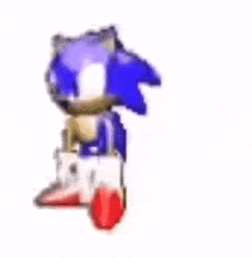 a blurry picture of a cartoon character , sonic the hedgehog , standing on a white surface .