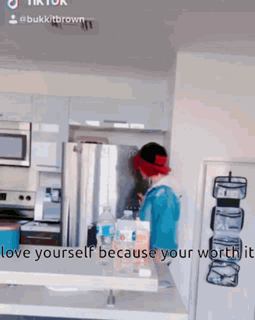 a person is standing in a kitchen with the words " give yourself because your worth is worth it "
