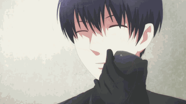 a man with his eyes closed and his hand on his face