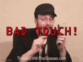 a man in a suit and tie is holding a pair of glasses and saying bad touch