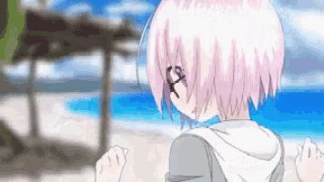 a girl with pink hair is running on the beach .