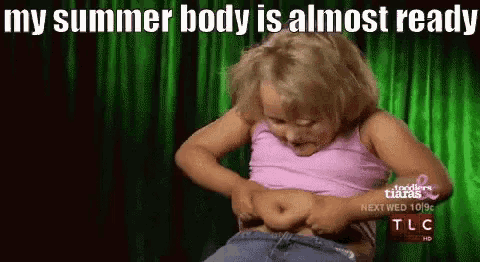 a little girl is looking at her stomach with the caption my summer body is almost ready .