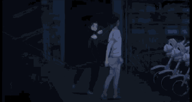 a silhouette of two people standing next to each other holding a stick .