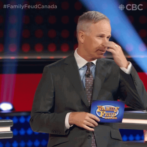 Pinch Nose Gerry Dee GIF - Pinch Nose Gerry Dee Family Feud Canada GIFs