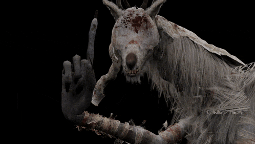 a statue of a deer with a hand pointing up