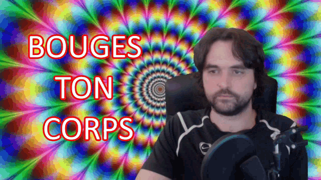 a man is sitting in front of a colorful background with the words bouge ton corps