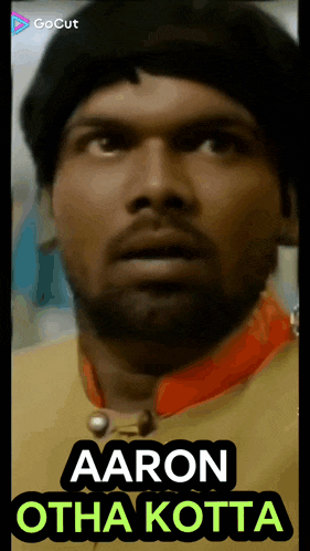 a close up of a man 's face with the words aaron otha kotta below him