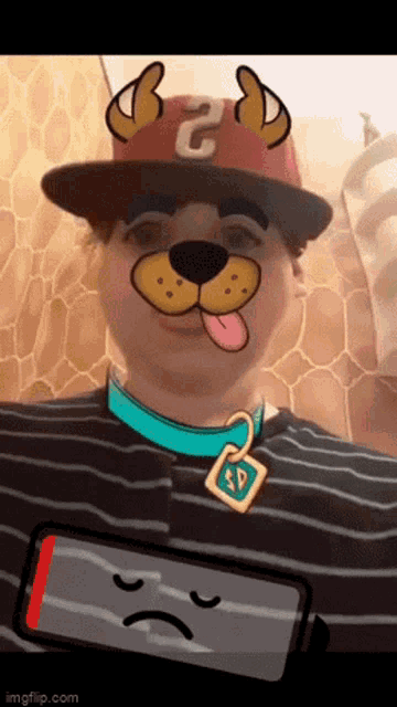 a person wearing a scooby doo mask with a low battery