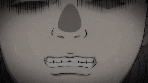 a close up of a person 's face with a surprised look on his face