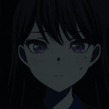 a close up of a girl 's face in the dark