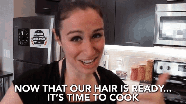 a woman in a kitchen with the words now that our hair is ready it 's time to cook