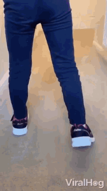 a person 's legs are shown in a viralhog gif