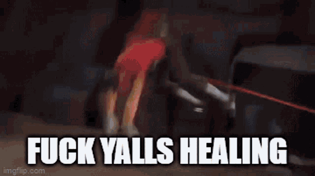 a gif of a person saying fuck yalls healing with a red background .