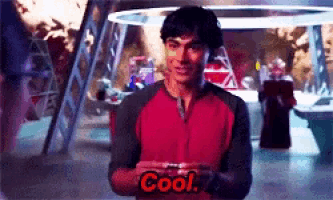 a man in a red shirt with the word cool on his shirt