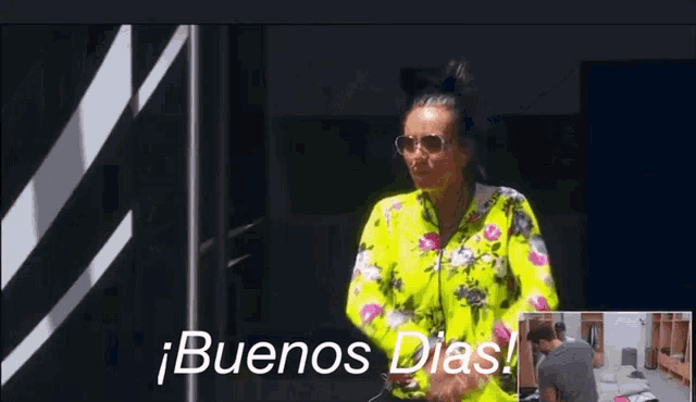 a woman wearing sunglasses and a neon yellow floral shirt says buenos dias