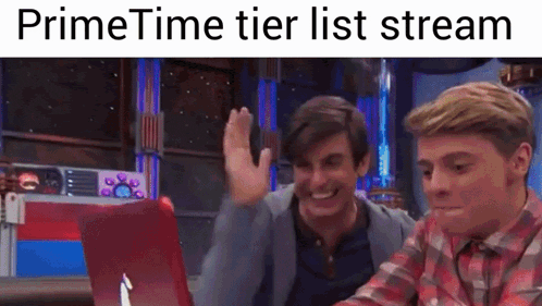 two men are sitting in front of a laptop with the words primetime tier list stream on the bottom