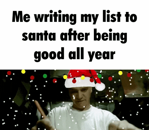a man wearing a santa hat is writing his list