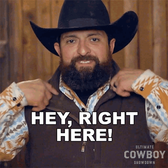 a man with a beard wearing a cowboy hat and vest says hey right here