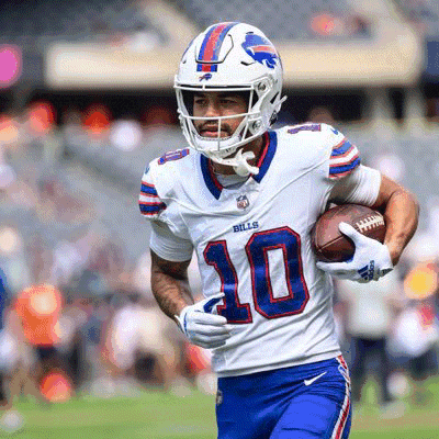 a buffalo bills player is running with the ball
