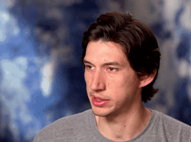 a close up of a man 's face with a blurry background