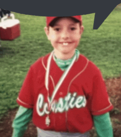 a young boy wearing a red jersey with the word cresties on the front