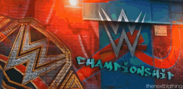 a wrestler is holding a wrestling championship belt in a dark alleyway