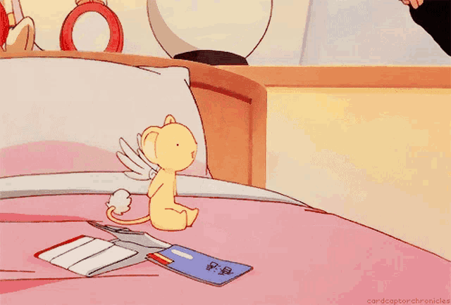 a cartoon drawing of a girl looking at a stuffed animal with the words cardcaptorchronicles below it